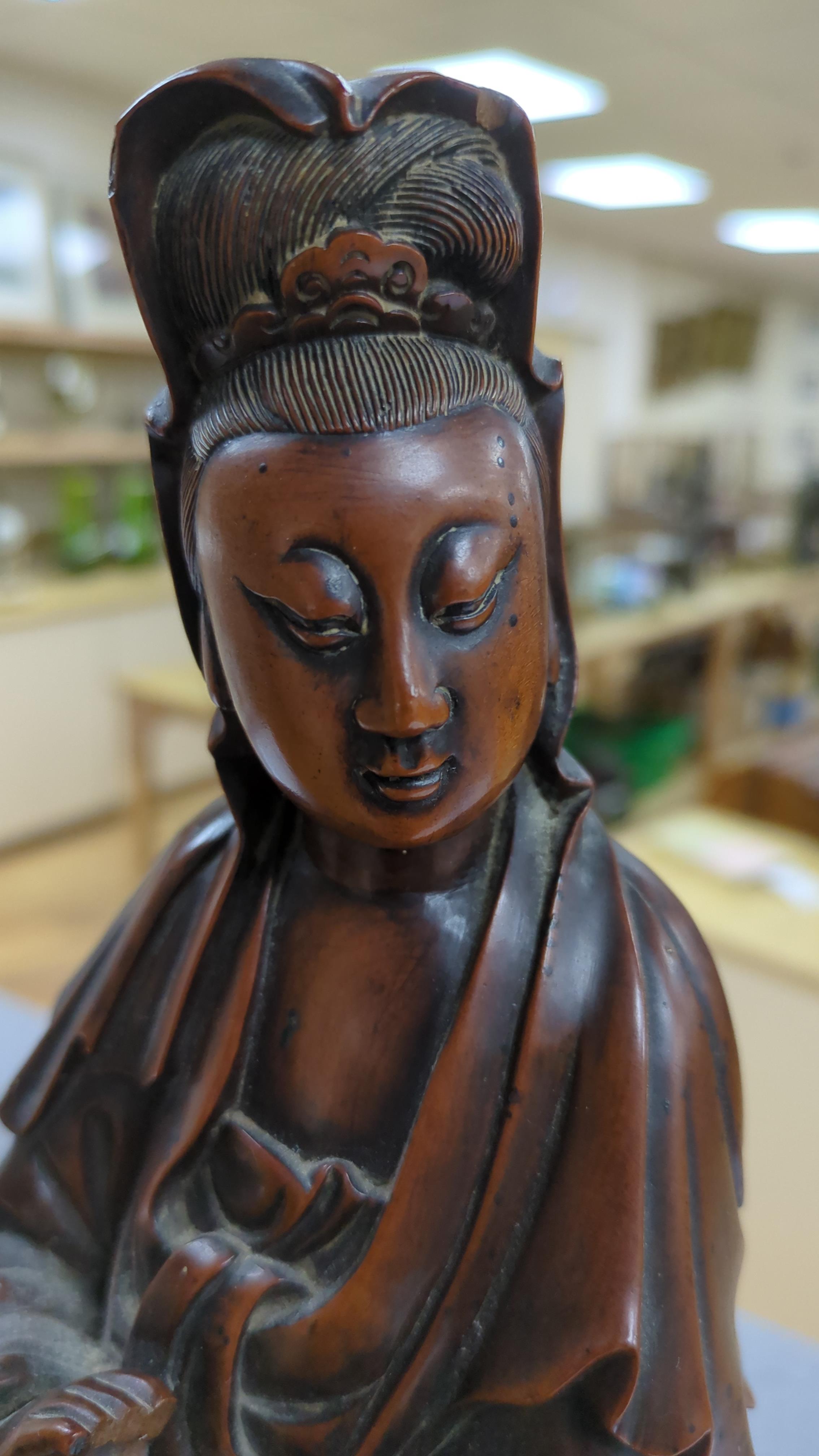 A Chinese carved boxwood figure of Guanyin, 19th century, 37cm high